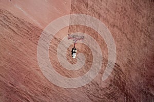 Aerial view of a tractor plowing a field. Copy space