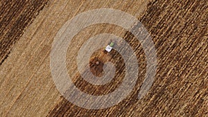 Aerial view of tractor working on a field.