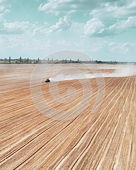 Aerial view of a tractor working in a field
