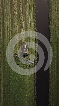Aerial view of tractor working in greenery field