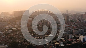 Aerial view of traditional city buildings and modern skyscraper at dusk in Jinjiang China