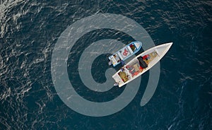 Aerial view of traditional fishing boat in Caraballeda with crystal clear turquoise sea, La Guaira, Venezuela.