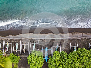 Aerial view of traditional Indonesian fishing boats on beach