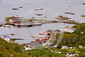 Aerial view on traditional Norwegian fisherman Rorbu houses in small port village with islets around, Vesteralen, Norway