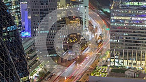 Aerial view of traffic on Al Saada street in financial district night timelapse in Dubai, UAE.