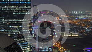 Aerial view of traffic on Al Saada street in financial district night timelapse in Dubai, UAE.