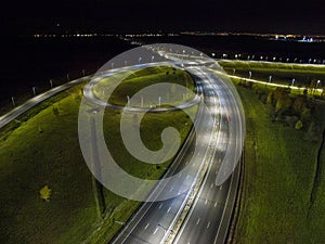 Aerial view of the traffic intersection outside the city at night