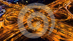 Aerial view of traffic on massive highway intersection at night