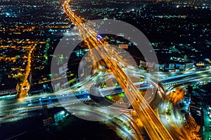 Aerial view of traffic in roundabout and highway at night