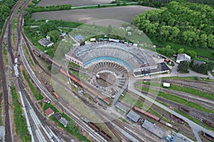 the aerial view of a train yard, the tracks and buildings