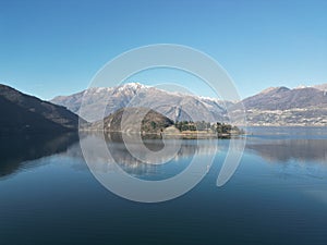 Aerial view of the tranquil Lago di Annone lake surrounded by majestic mountains photo