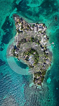 Aerial view of a tranquil tropical island surrounded by crystal blue waters in Isla del Pirata photo