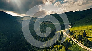 Aerial view of Transbucegi road in Bucegi Mountains from Romania in cloudy summer landscape