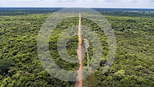 Aerial view of Transpantaneira dirt road crossing straight the North Pantanal Wetlands, Mato Grosso, Brazil