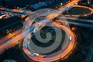 Aerial view of transport junction, asphalt city roads and Interchanges, top view from drone of circle motorways with bridges