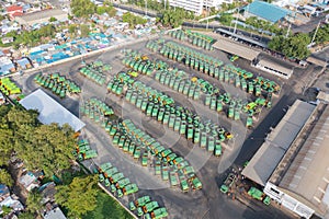 Aerial view of trash garbage tractor truck cars in industrial factory in environmental pollution. Waste disposal in dumping site