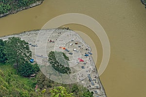aerial view of a trekking camp near river bed