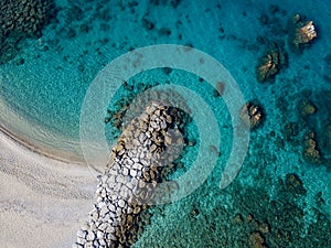 Aerial view of Tropea beach, crystal clear water and rocks that appear on the beach. Calabria, Italy. Swimmers, bathers floating photo