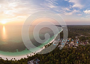 Aerial view tropical beach island reef caribbean sea dramatic sky at sunset sunrise. Indonesia Moluccas archipelago, Kei Islands,