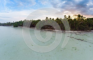 Aerial view tropical beach island reef caribbean sea dramatic sky at sunset sunrise. Indonesia Moluccas archipelago, Kei Islands,