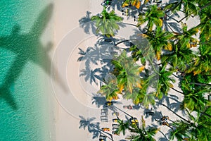 Aerial view of tropical beach. Punta Cana, Dominican Republic.Concept of airplane travel to exotic destination with shadow of