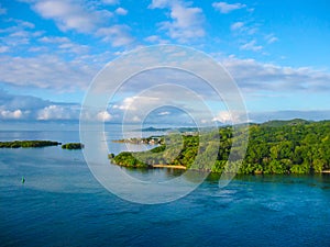 An aerial view of a tropical beach in Roatan Honduras