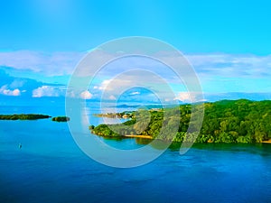 An aerial view of a tropical beach in Roatan Honduras