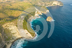 Aerial view on tropical coast Kelingking Beach with turquoise sea in Nusa Penida island, Bali, Indonesia.