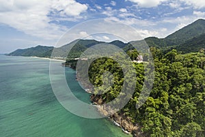 Aerial view of tropical coastline on Koh Chang, Thailand with temple, mountains,jungle and ocean