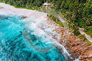 Aerial view of tropical dreamy beach Anse Bazarca, Mahe island, Seychelles. White powdery sand, azure water, lush