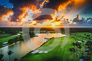 Aerial view of tropical golf course at sunset, Dominican Republic.