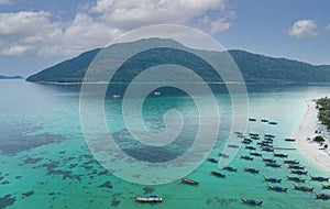 Aerial view of the Tropical island beach with seashore as the tropical island in a coral reef ,blue and turquoise sea with local