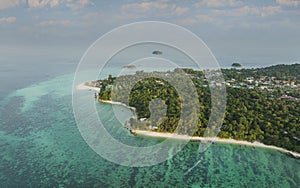 Aerial view of  the Tropical island beach with seashore as the tropical island in a coral reef ,blue and turquoise sea with local