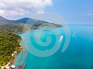 Aerial view of tropical island coast and beaches with blue transparent sea and green rainforest, paradise summer vacation holidays