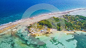 Aerial view of tropical island at Glover`s Reef Atoll in Belize