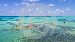 Aerial view of tropical island at Glover`s Reef Atoll in Belize with kayaks