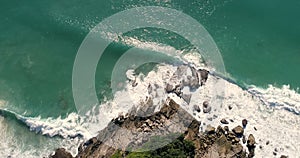 Aerial view of tropical island and sea waves