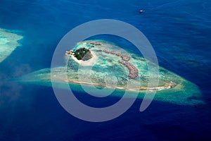 Aerial view of tropical paradise maldives island resort with coral reef turquoise blue ocean tourism background