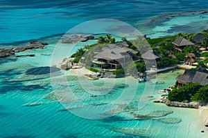 Aerial view of a tropical resort with overwater villas