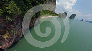 Aerial view tropical sand beach coastline with traditional Asian longtail boat