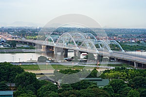 Aerial view of Tru bridge crossing Red River at twilight in Hanoi, Vietnam