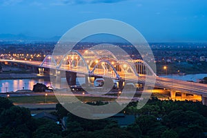 Aerial view of Tru bridge crossing Red River at twilight in Hanoi, Vietnam