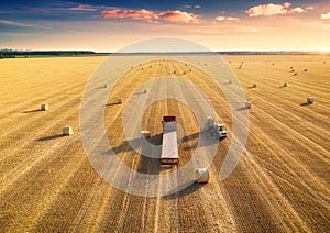 Aerial view of truck with hay bales. Agricultural machinery