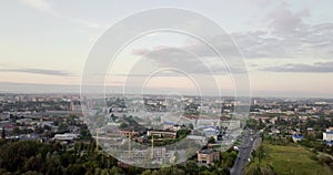 Aerial view of a truck and other traffic driving along a road at sunrise. Beautiful sunset over the road full of traffic