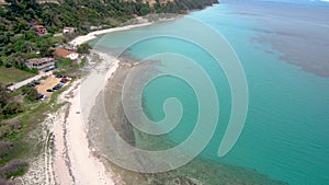 Aerial view of turquoise stunning beach, Athitos Halkidiki Greece,move forward and downward by drone