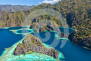 Aerial view of turquoise tropical lagoon with limestone cliffs in Coron Island, Palawan, Philippines. UNESCO World