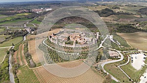 Aerial view of Tuscan landscape with ancient walled city Monteriggioni, Siena, Italy. Tuscany medieval town on the hill.