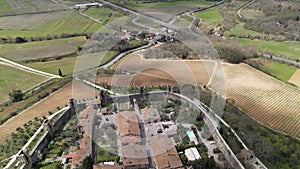 Aerial view of Tuscan landscape with ancient walled city Monteriggioni, Siena, Italy. Tuscany medieval town on the hill.
