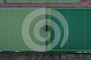 Aerial view of two different sport field with artificial grass in different shades of green