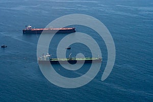 Aerial view of two Freighters anchored off the coast of Long Beach